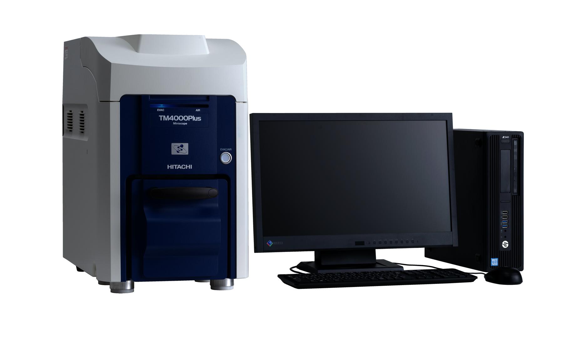 Ein kastenförmiges Tischmikroskop neben einem Bildschirm mit Maus und Tastatur und einem Computer.